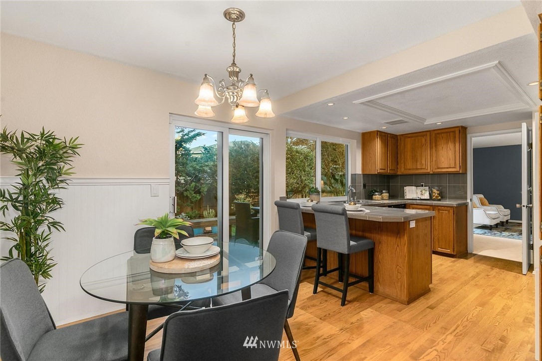 707 Harvest Road Bothell, WA 98012 - Photo 7 of 27 a view of a dining room with furniture window and outside view
