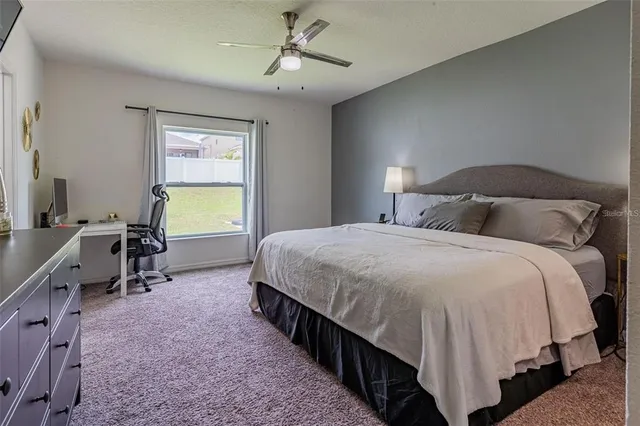 a bed room with a bed and a window