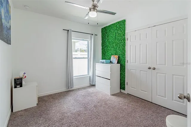 a view of a room with closet and windows
