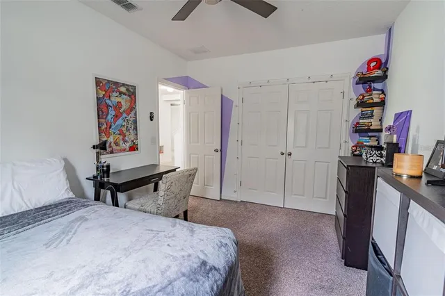 a bedroom with furniture and a bed