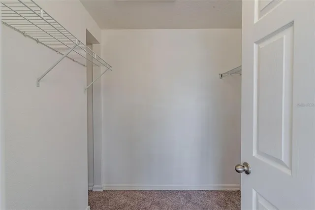 a bathroom with a sink vanity mirror and toilet