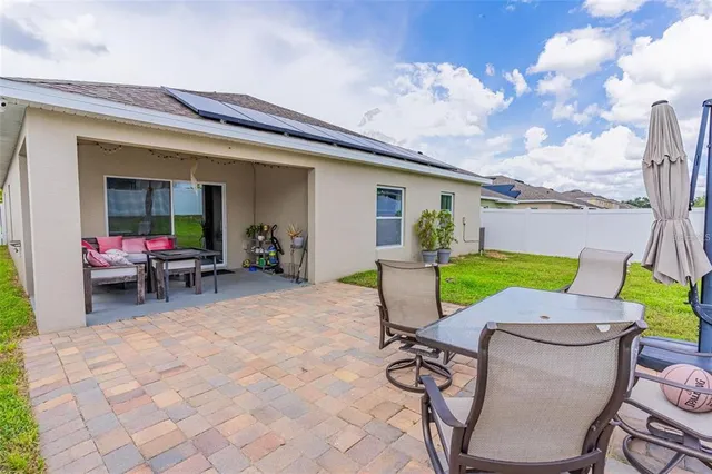 an aerial view of a residential houses with outdoor space