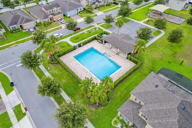 a aerial view of a house with a yard