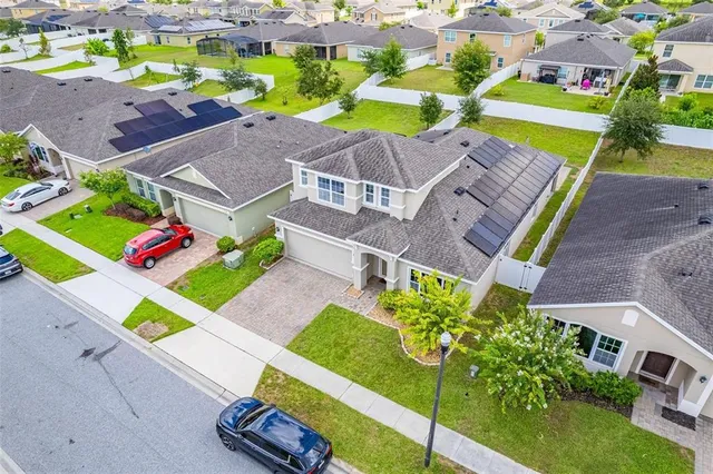 a view of a patio with table and chairs and potted plants