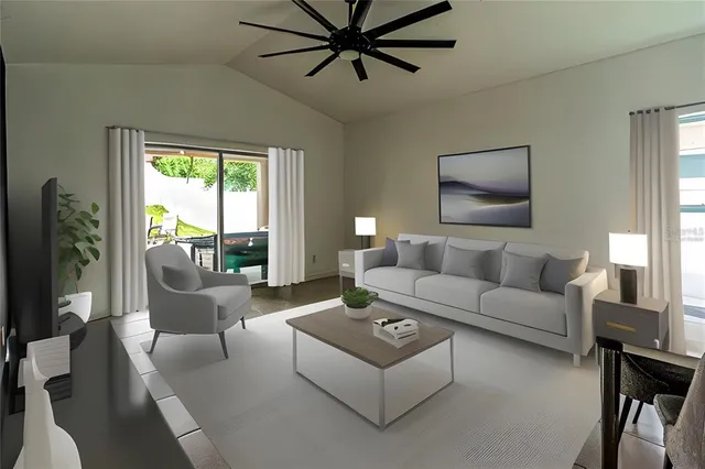 a living room with furniture and a large window