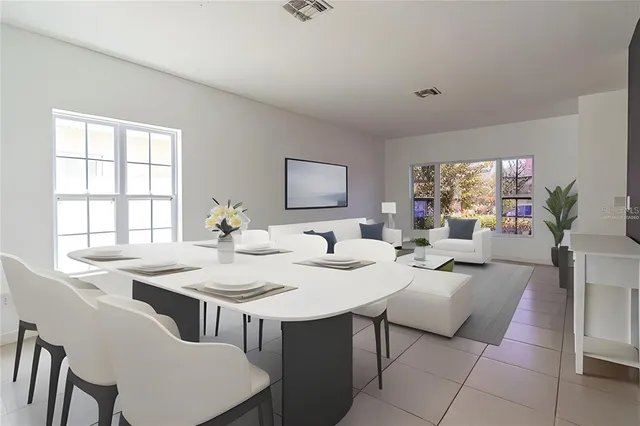 a view of a dining room with furniture and window