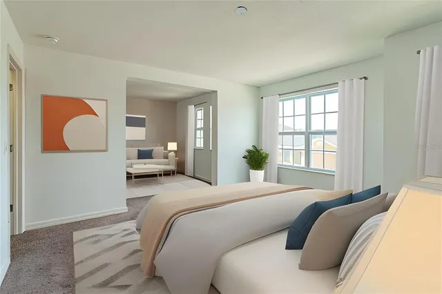 a bedroom with a bed and window