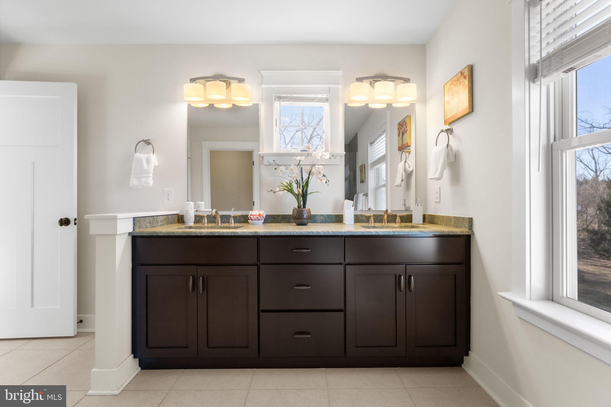 129 Conestoga Road Malvern, PA 19355 - Photo 38 of 69 a bathroom with a double vanity sink and a mirror