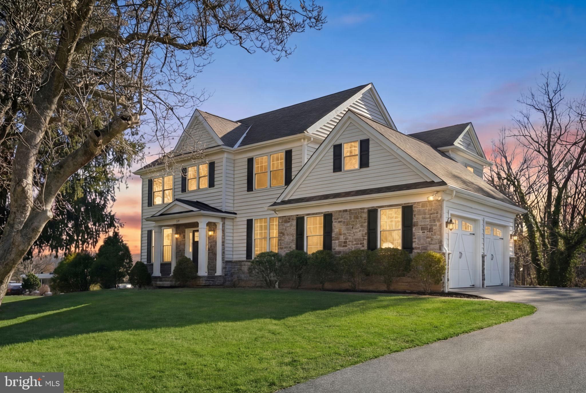 129 Conestoga Road Malvern, PA 19355 - Photo 4 of 69 a front view of a house with a garden
