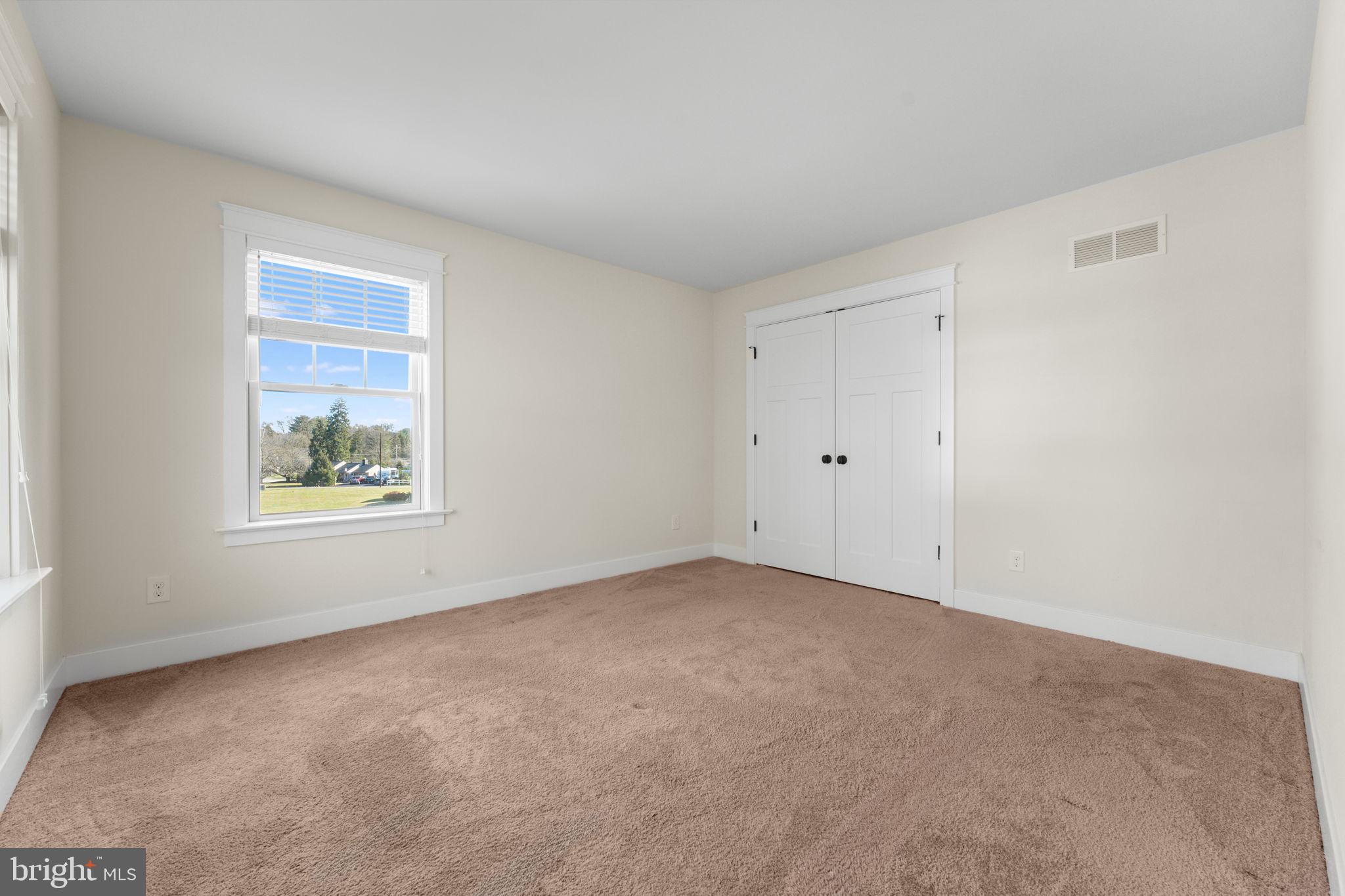 129 Conestoga Road Malvern, PA 19355 - Photo 46 of 69 a view of an empty room with a window