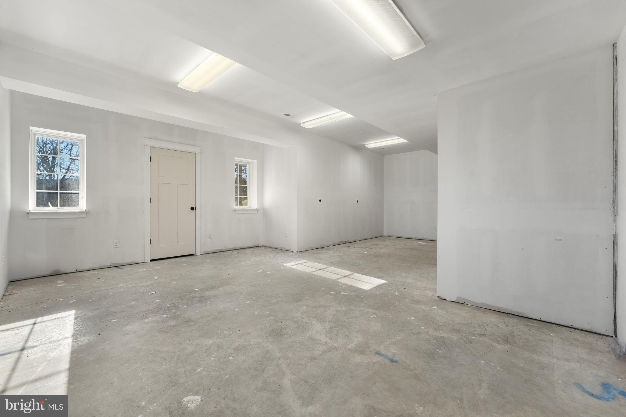 129 Conestoga Road Malvern, PA 19355 - Photo 56 of 69 an empty room with windows