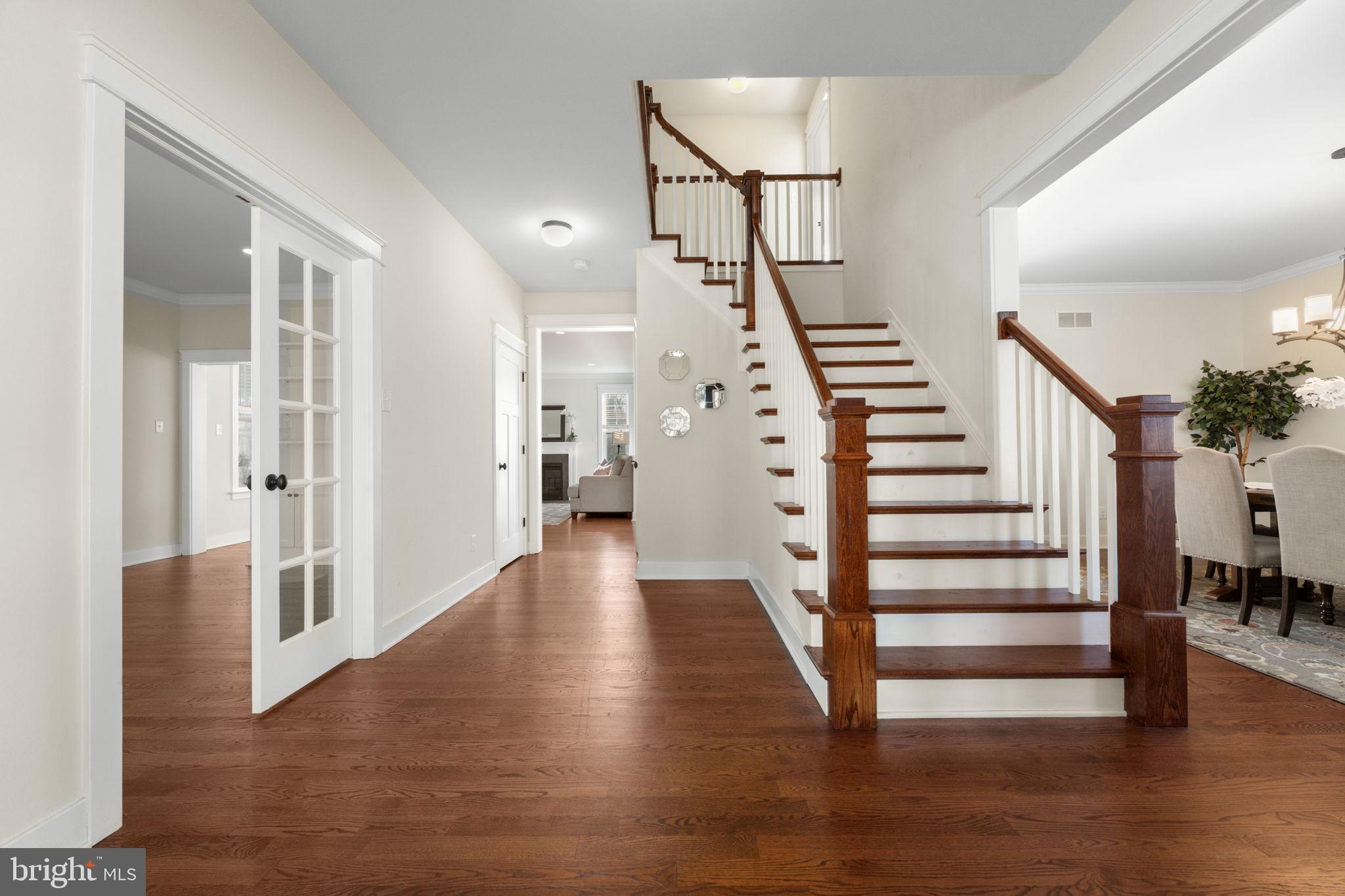 129 Conestoga Road Malvern, PA 19355 - Photo 7 of 69 a view of entryway with wooden floor and stairs