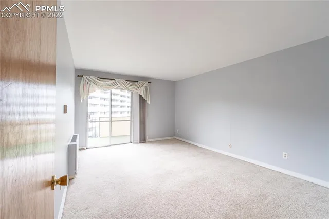 a view of an empty room and closet