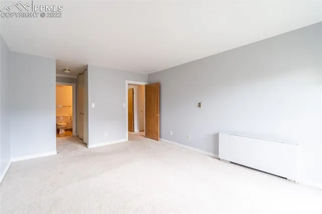 a view of a hallway with a white walls