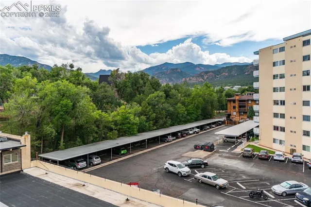 a view of a balcony with two chairs and a table
