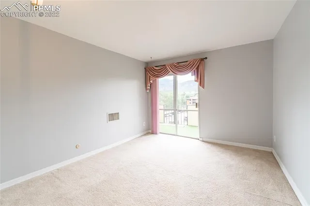 a view of a city with lush green forest