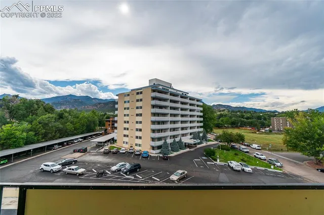 a view of a two chairs in the balcony