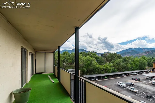 a view of a street with a building in the background
