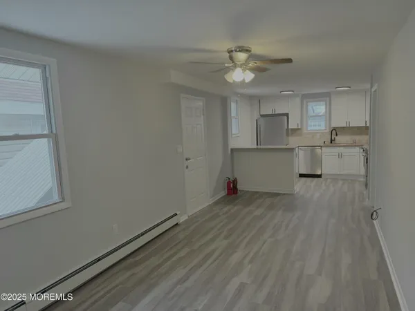 a view of a kitchen with a sink and dishwasher