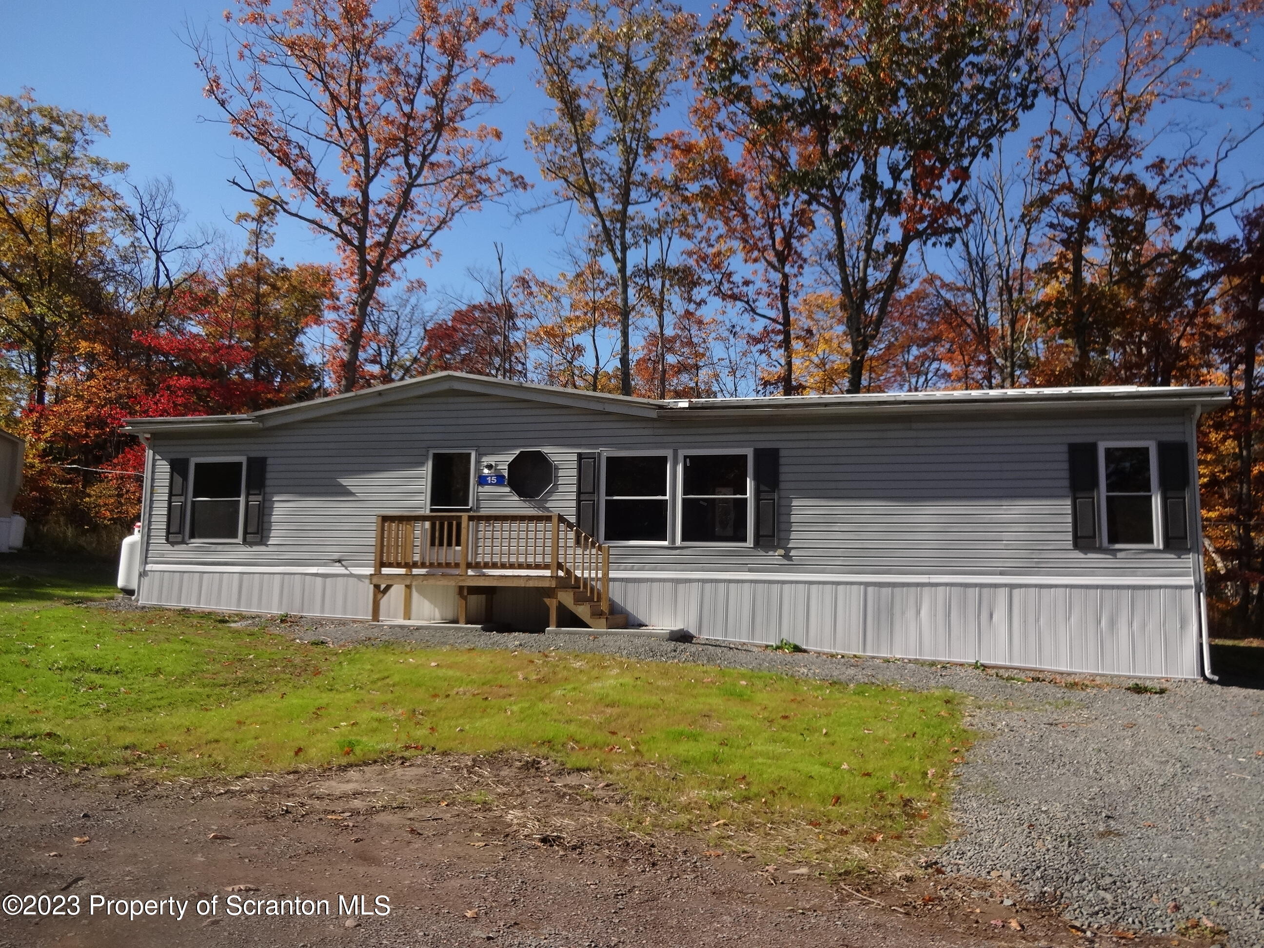 15 Hi View Lake Ariel, PA 18436 - Photo 21 of 21 a front view of house with yard and trees in the background
