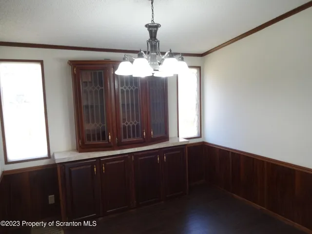 a view of a windows and chandelier in a room