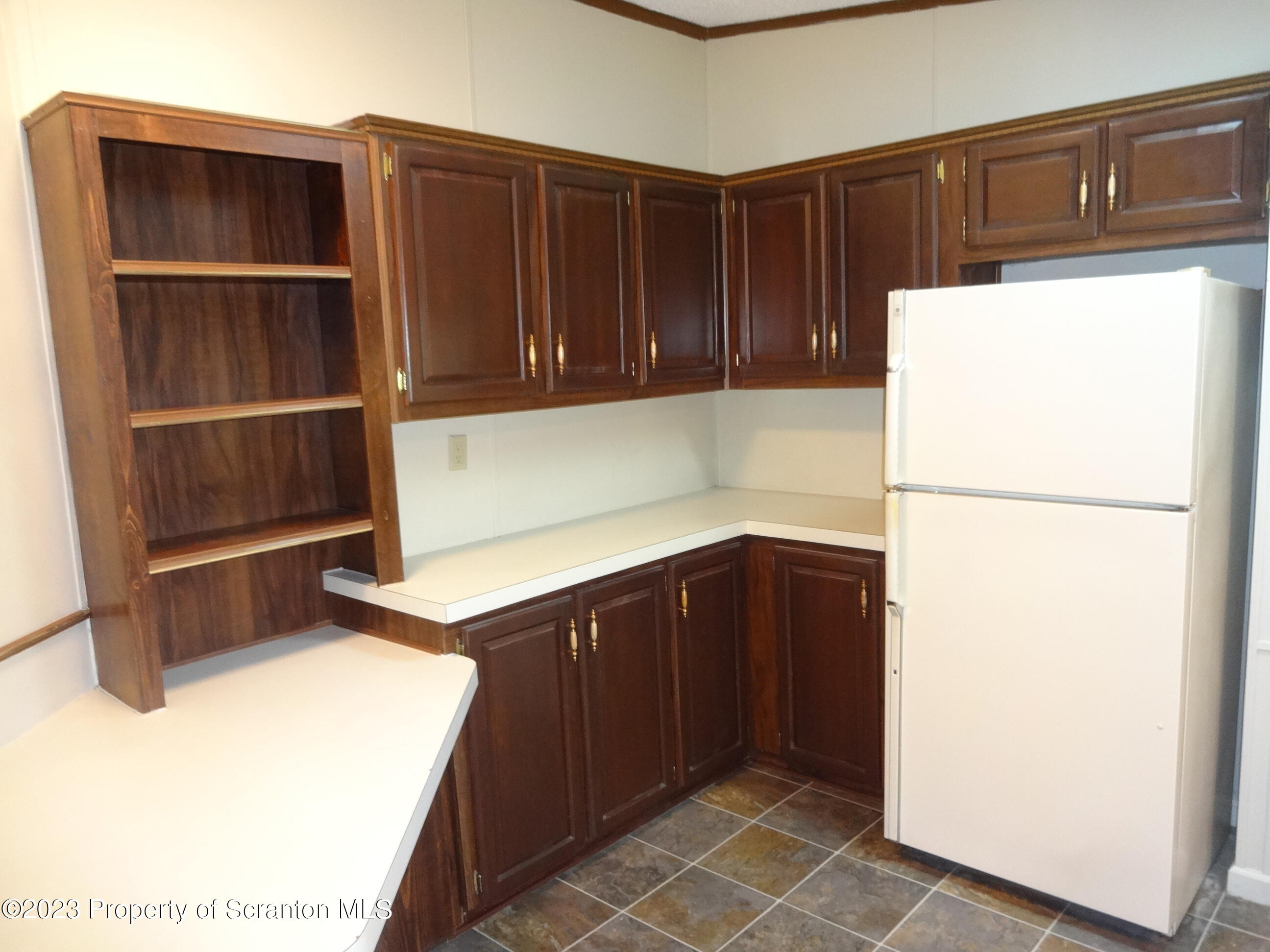 15 Hi View Lake Ariel, PA 18436 - Photo 6 of 21 a kitchen with a refrigerator and cabinets