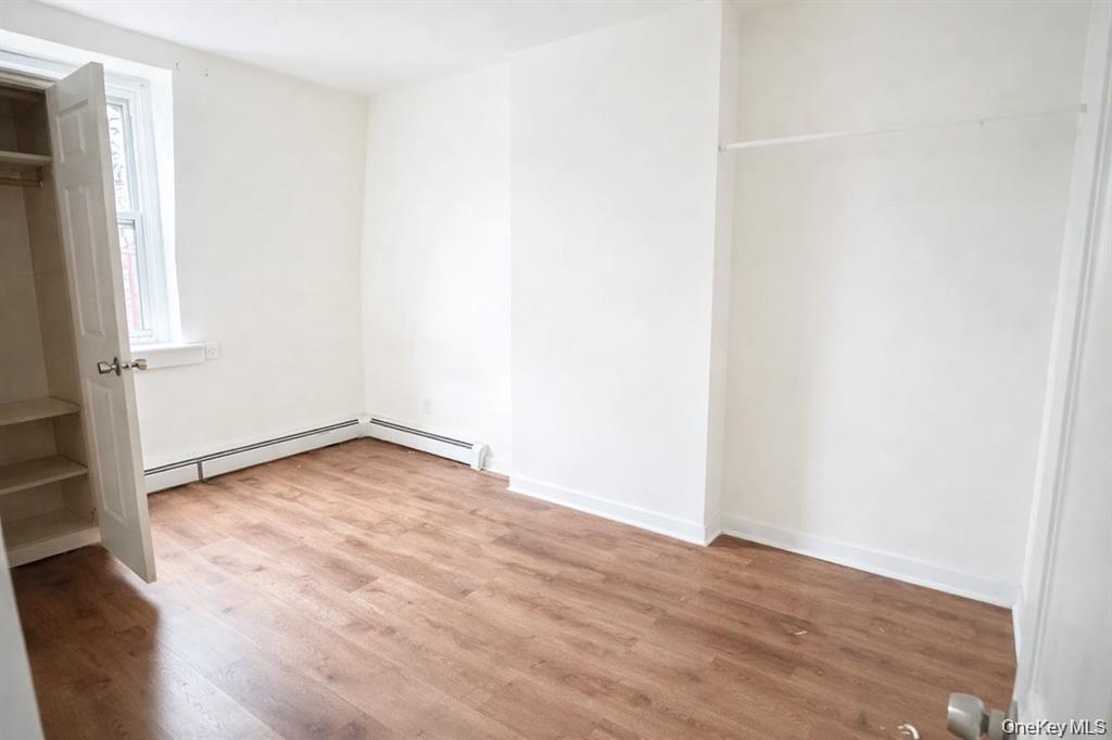 296 Mill Street, Unit 3 Poughkeepsie, NY 12601 - Photo 5 of 6 a view of empty room with wooden floor