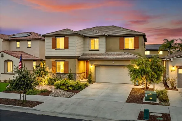 a front view of a house with yard