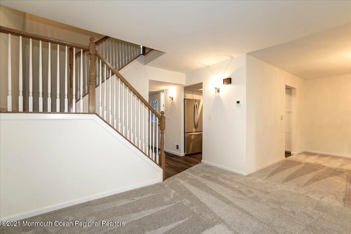121 Walnut Drive Spring Lake Heights, NJ 07762 - Photo 11 of 44 a view of a hallway with wooden floor and entryway