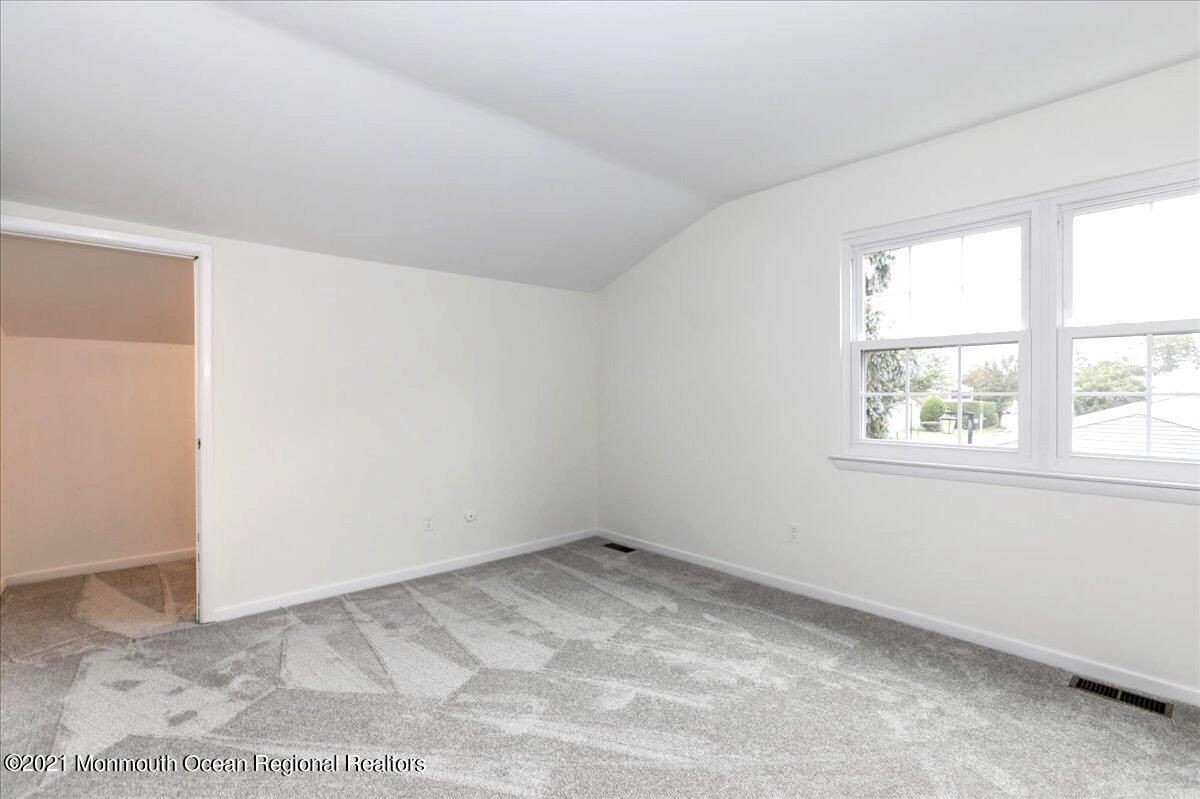 121 Walnut Drive Spring Lake Heights, NJ 07762 - Photo 13 of 44 an empty room with a window
