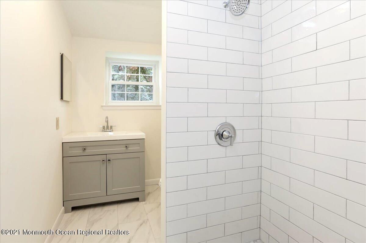 121 Walnut Drive Spring Lake Heights, NJ 07762 - Photo 17 of 44 a bathroom with a shower
