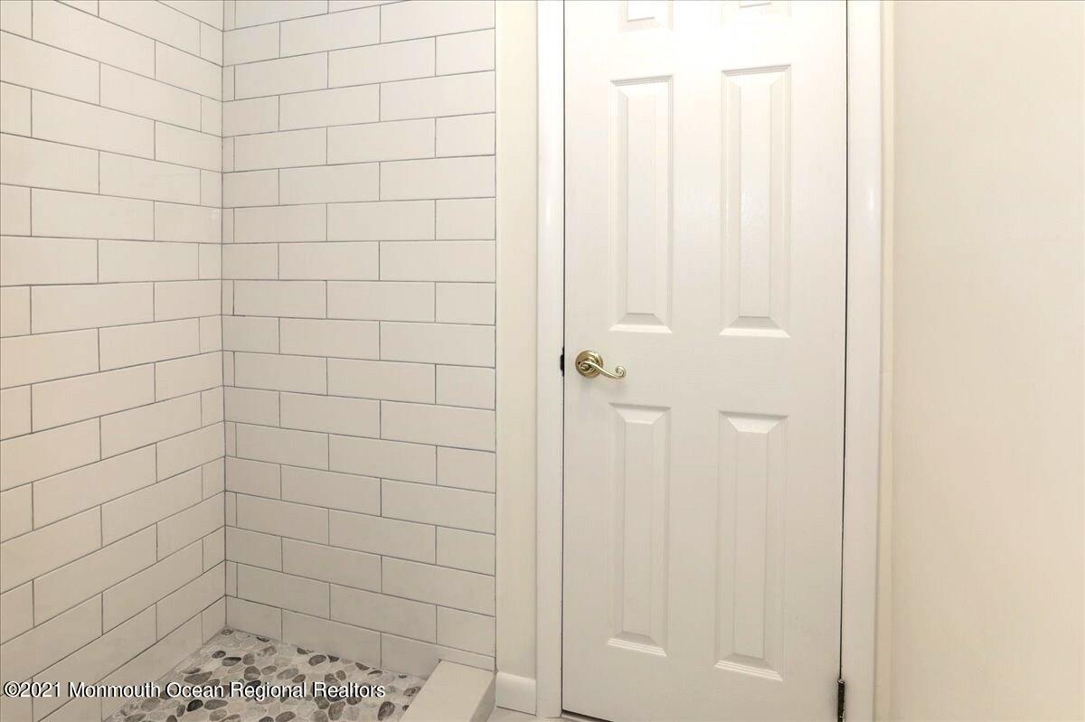 121 Walnut Drive Spring Lake Heights, NJ 07762 - Photo 18 of 44 a bathroom with a shower