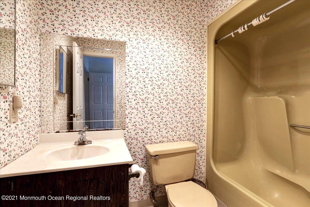 121 Walnut Drive Spring Lake Heights, NJ 07762 - Photo 27 of 44 a bathroom with a sink toilet and shower