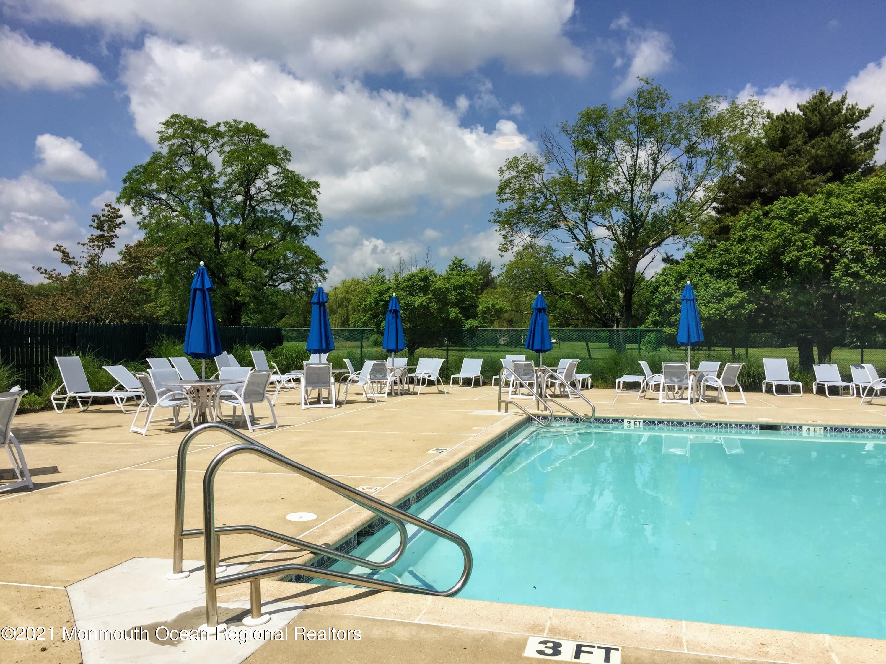 121 Walnut Drive Spring Lake Heights, NJ 07762 - Photo 37 of 44 a view of swimming pool with outdoor seating and plants