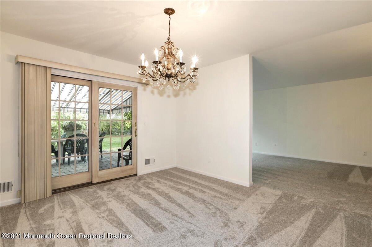 121 Walnut Drive Spring Lake Heights, NJ 07762 - Photo 8 of 44 a view of an empty room with a window