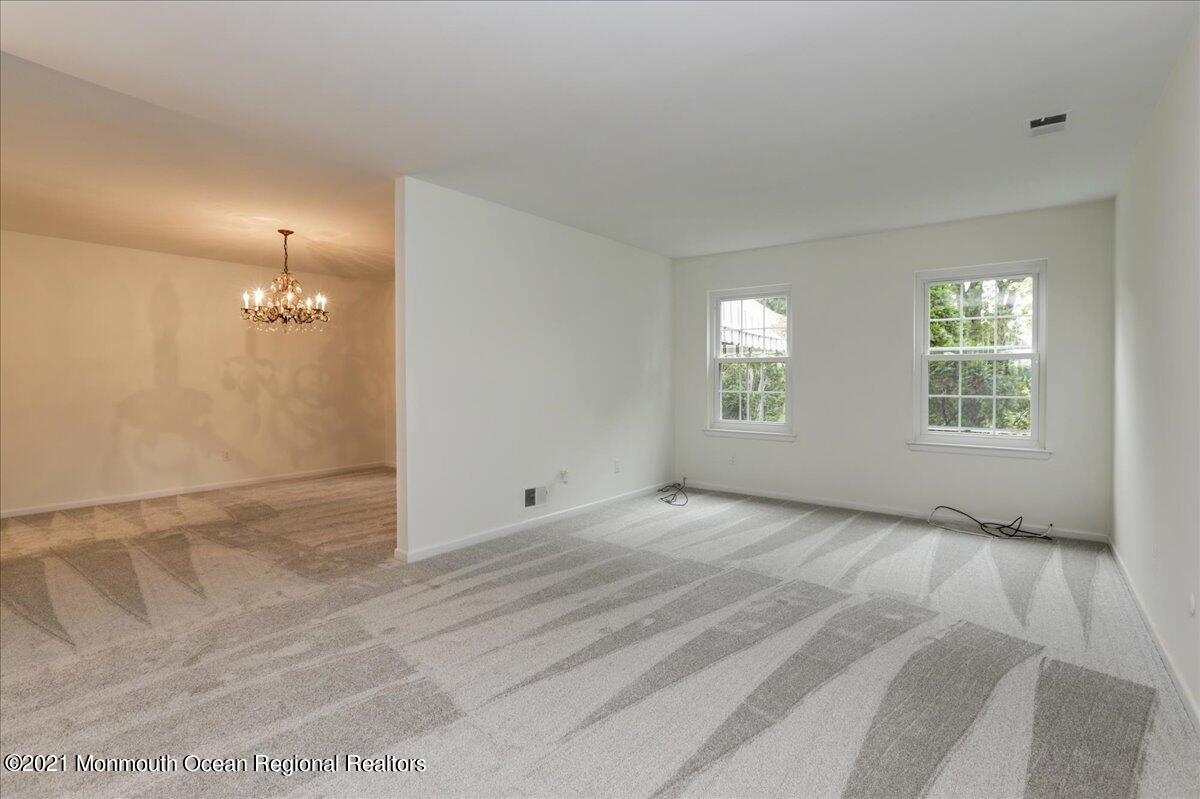 121 Walnut Drive Spring Lake Heights, NJ 07762 - Photo 9 of 44 a view of an empty room with a window