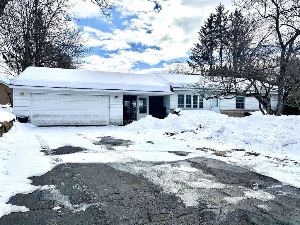 310 Palmer Road Ware, MA 01082 - Photo 1 of 16 a view of white house with a snow in the yard