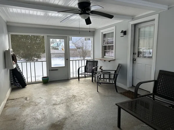 a view of a livingroom with furniture and windows