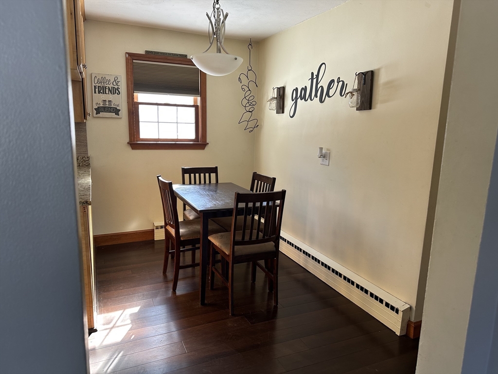 310 Palmer Road Ware, MA 01082 - Photo 4 of 16 a view of a dining room with furniture and wooden floor
