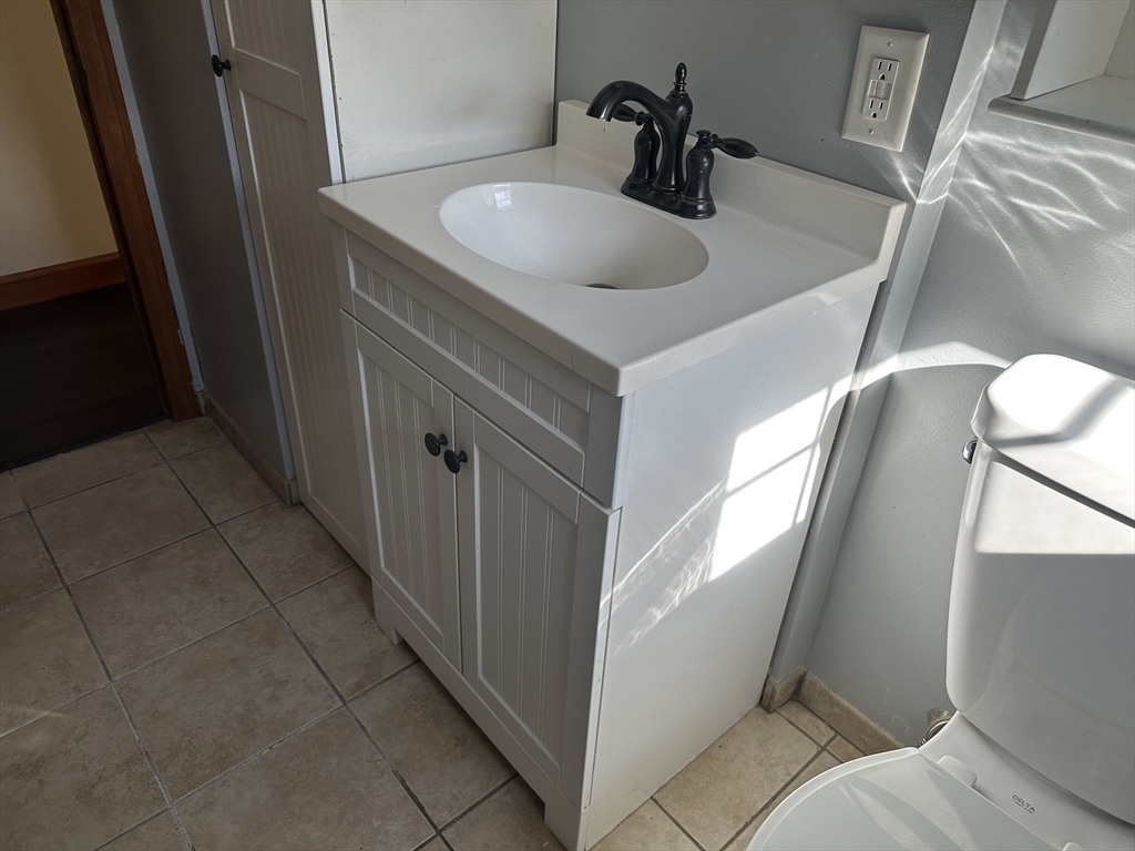 310 Palmer Road Ware, MA 01082 - Photo 8 of 16 a bathroom with a sink and mirror