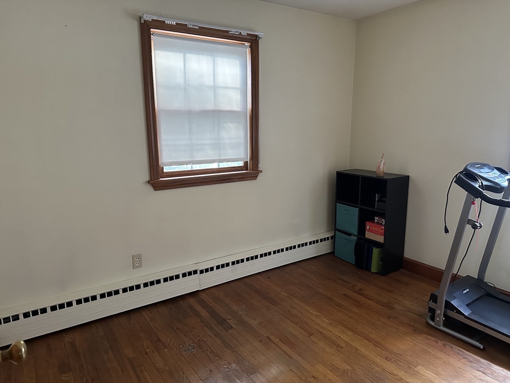 310 Palmer Road Ware, MA 01082 - Photo 10 of 16 a view of empty room with wooden floor and fan