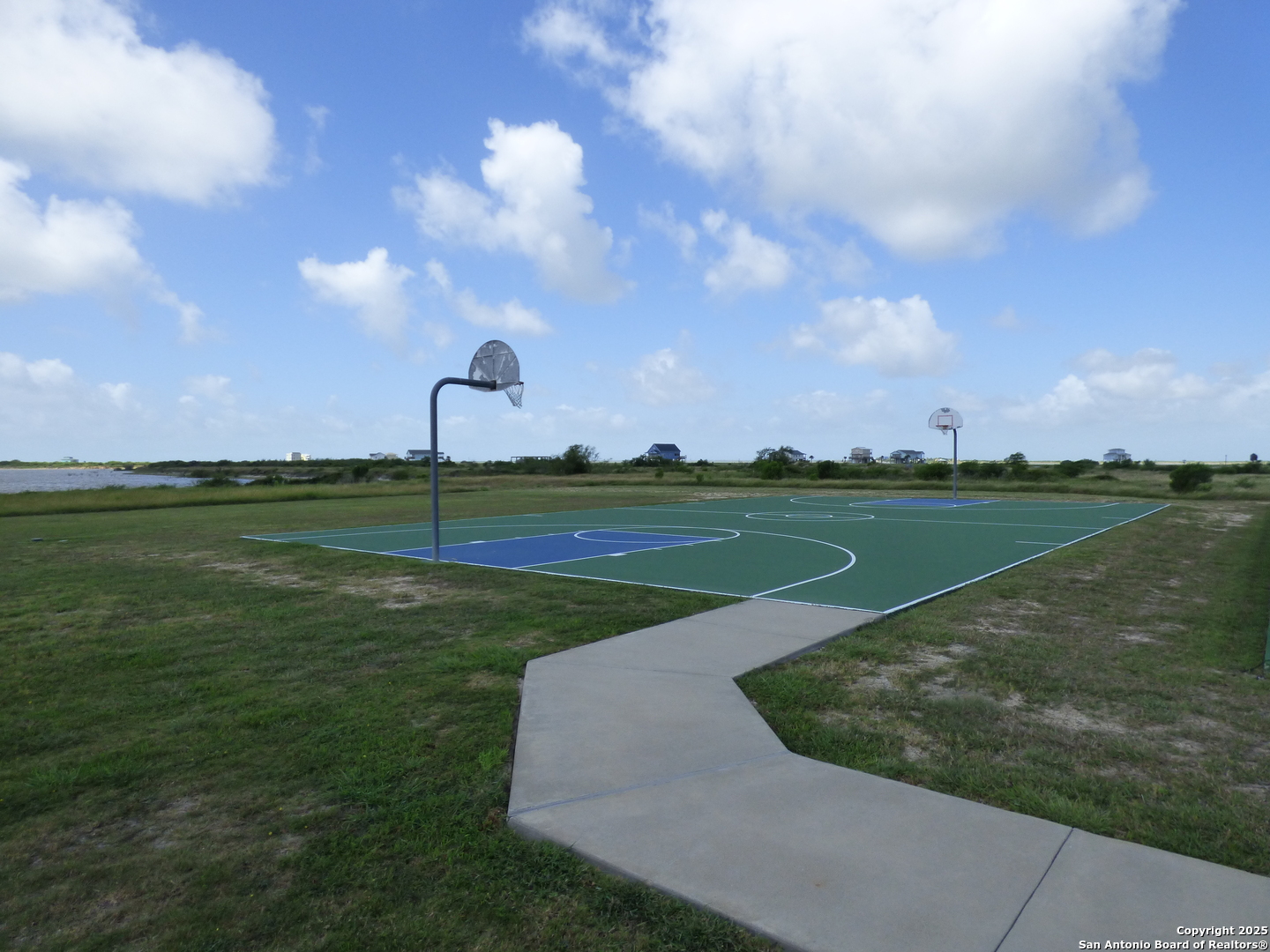 3414 Beachside Boulevard Palacios, TX 77465 - Photo 11 of 22 a view of a golf course with a lake