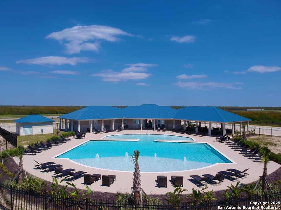3414 Beachside Boulevard Palacios, TX 77465 - Photo 6 of 22 an aerial view of a house with outdoor space pool seating area and fire pit
