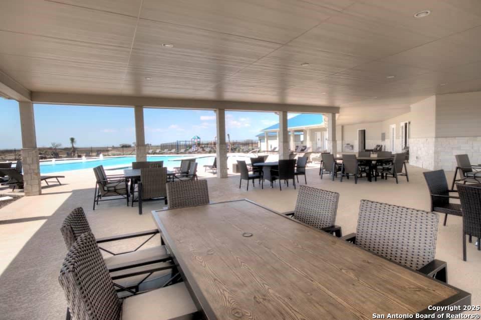 3414 Beachside Boulevard Palacios, TX 77465 - Photo 8 of 22 a living room with lots of furniture and a floor to ceiling window