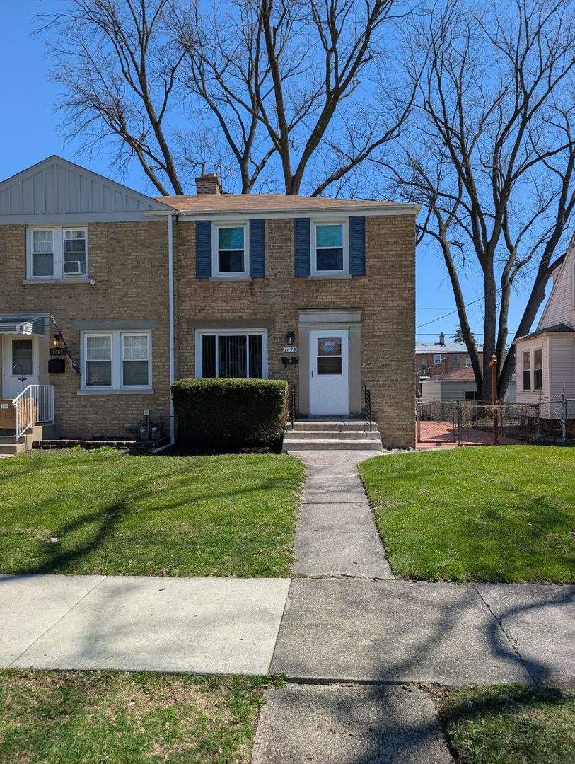 1673 Linden Street Des Plaines, IL 60018 - Photo 1 of 9 a front view of a house with a garden