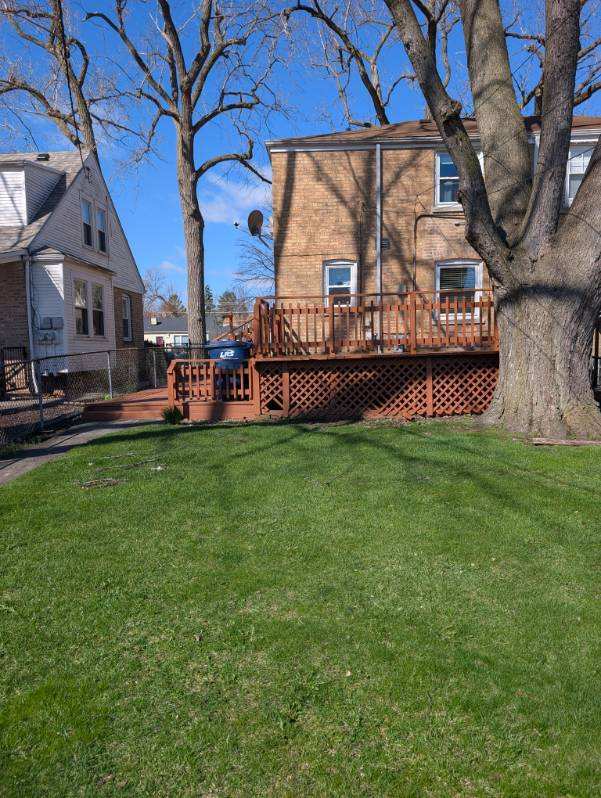 1673 Linden Street Des Plaines, IL 60018 - Photo 4 of 9 a view of a house with a back yard