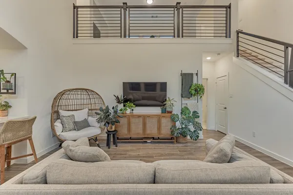 a room with furniture and a potted plant