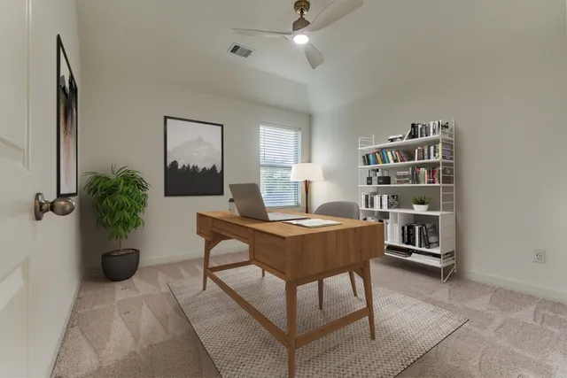 a workspace with furniture and window