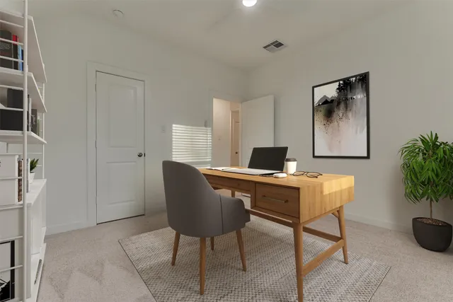 a workspace with furniture and window