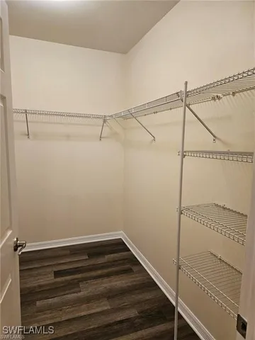 a bathroom with a double vanity sink mirror and shower